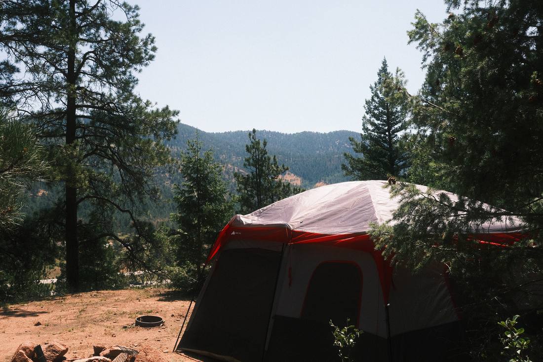 Tent campsite set up beneath the pines at Wishing Well